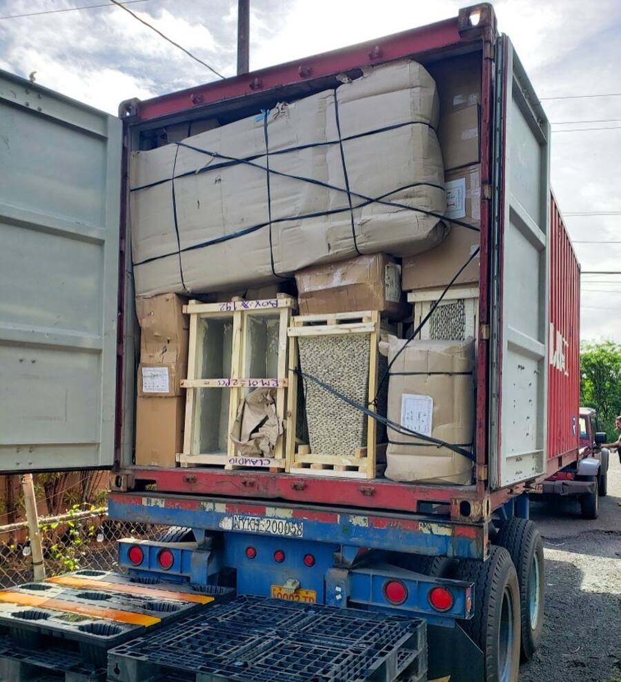 Shipping container packed with crated goods